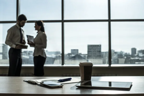 Businessman and Businesswoman in office