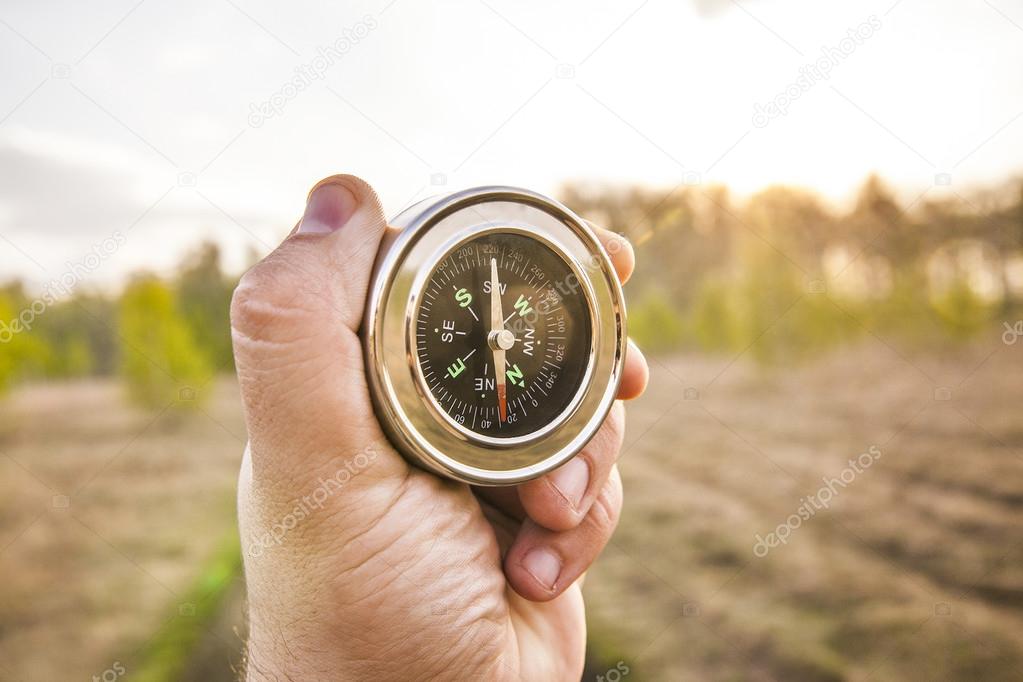  man holding compass