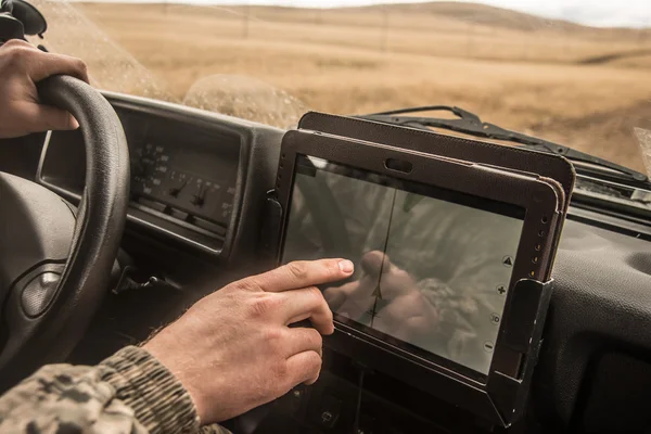 Soldier driving brutal SUV — Stock Photo, Image