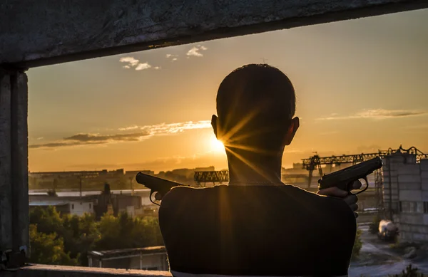 Silhouette of a soldier  with a guns — Stock Photo, Image