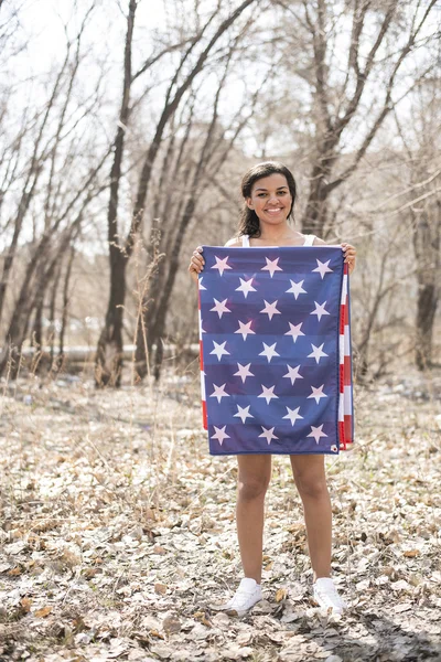 Woman holding american flag — Stock Photo, Image