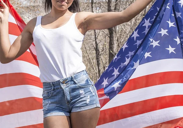 Girl holding  american flag smiling — Stock Photo, Image