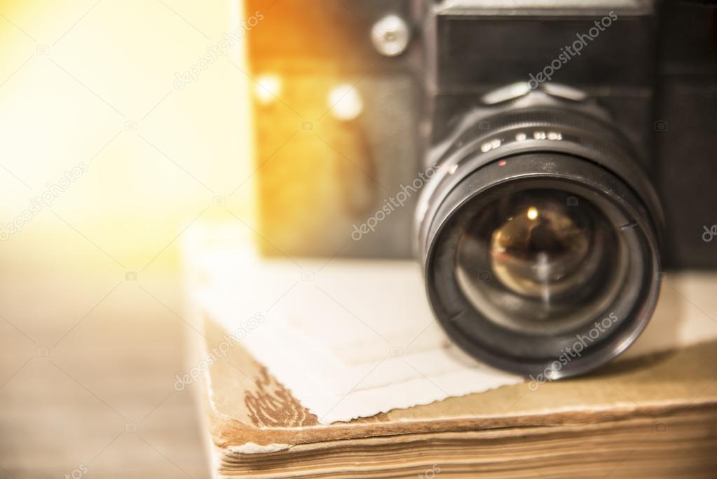 camera lens over wooden table