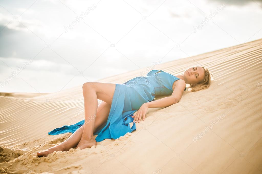 young woman posing in desert. 