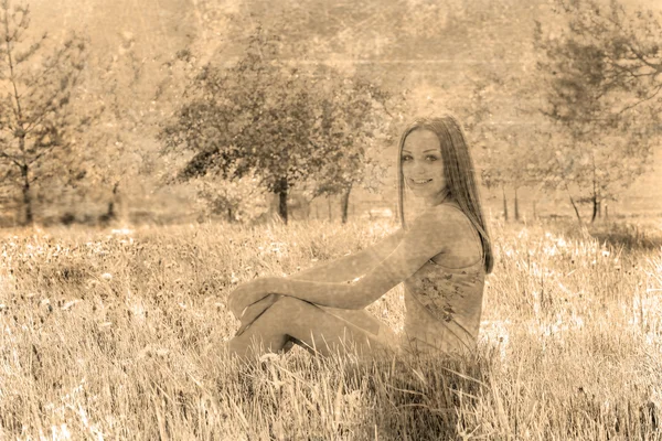 young woman  on a meadow