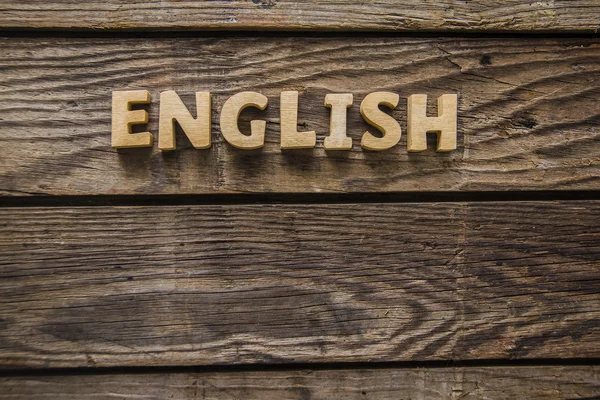 Slovo anglicky od dřevěných písmen. — Stock fotografie