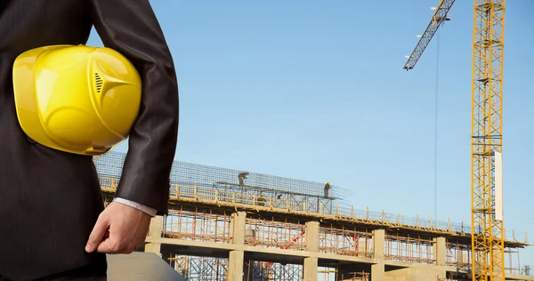 Businessman holding  helmet — Stock Photo, Image