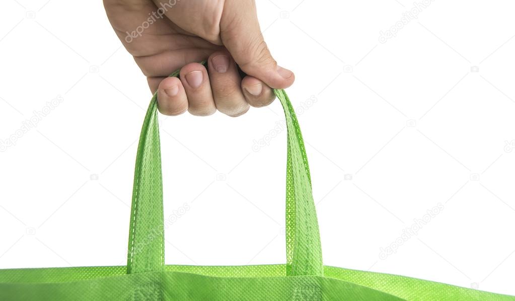man holding green Fabric tote  