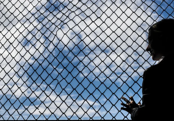 Woman silhouette standing  near  Net — Stock Photo, Image