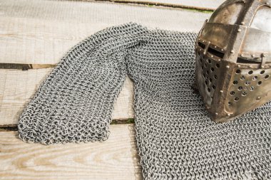 old knight helmet and chain mail  clipart
