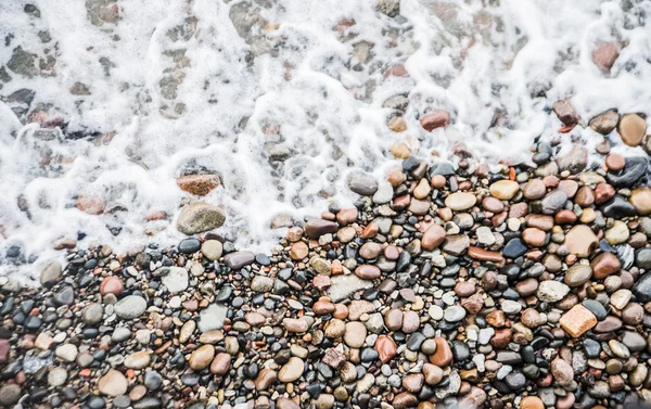 Havet stenar på stranden — Stockfoto