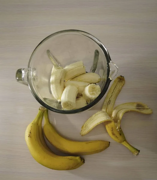 bunch of bananas. blender, smoothie preparation, top view. Concept of fitness healthy eating, clean eating, sport lifestyle
