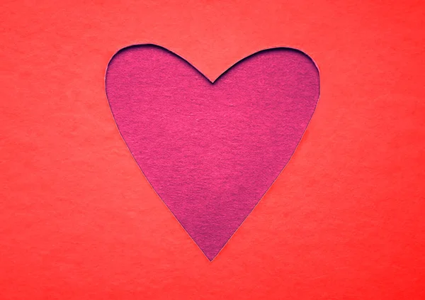 Paper red  heart cut from paper. isolated on  background.