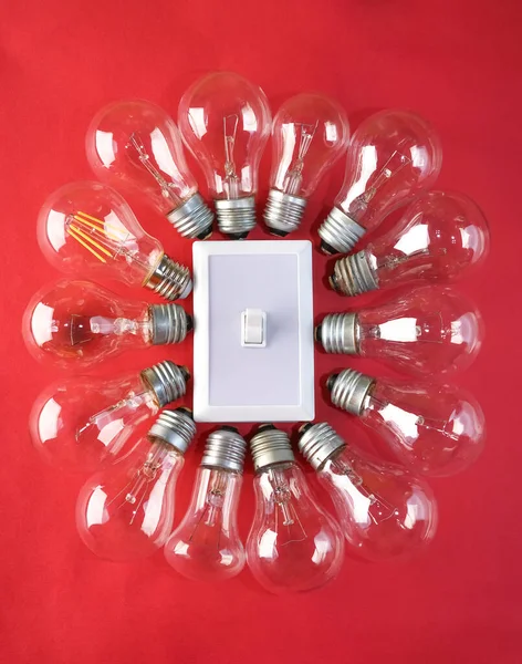 Plastic Switch Center Many Lamps Bulb Isolated Red Background — Stock Photo, Image