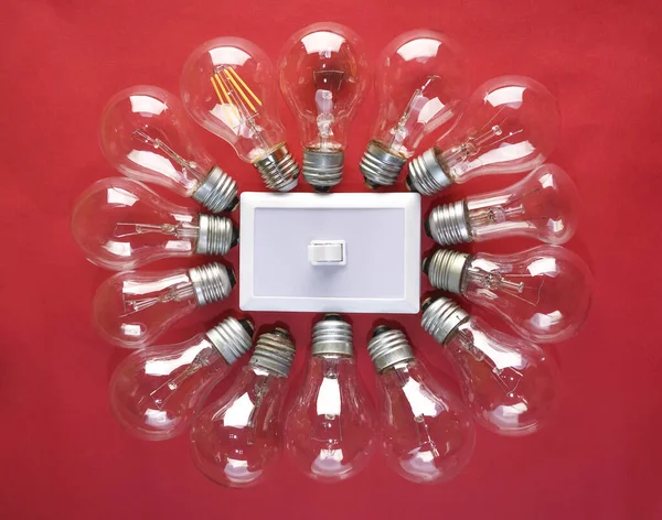 Plastic Switch Center Many Lamps Bulb Isolated Red Background — Stock Photo, Image