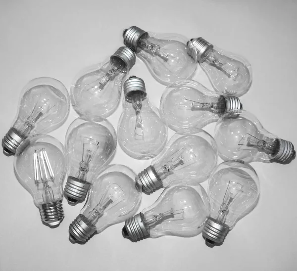 Many New Incandescent Lamp Bulbs Paper Background Top View — Stock Photo, Image