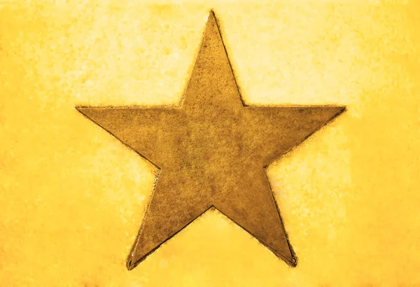 Una Estrella Dorada Fondo Amarillo — Foto de Stock