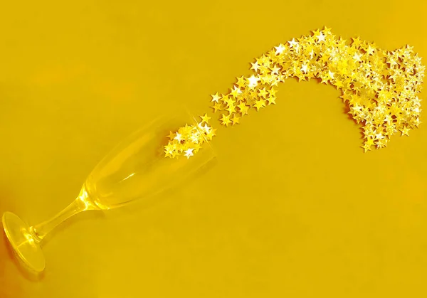 Golden Stars Confetti Spilled Champagne Glass — Stock Photo, Image