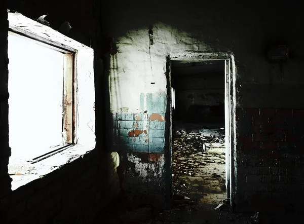 Abandoned building with door and window frame. The gloomy place was empty and dilapidated