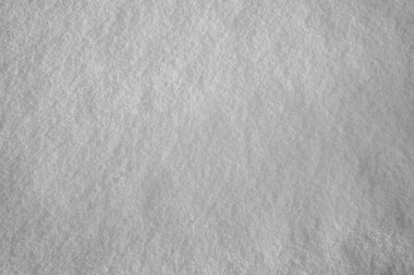 Kar yağışı yüzeyi. Beyaz, taze kar arka planı. en üstteki görünüm.