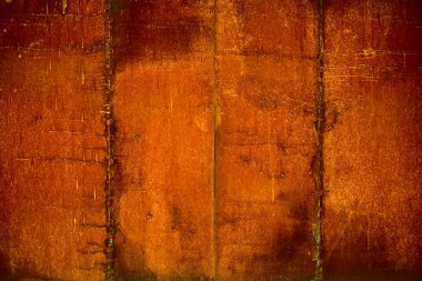 Arka plan için paslı çelik döşeme. Eski paslı metal dokusunda aşınma izleri var. 