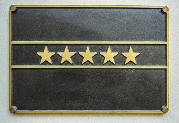 Hotel star rankings. five 5 stars.  hotel sign board - five 5 stars for luxury. iron signboard.