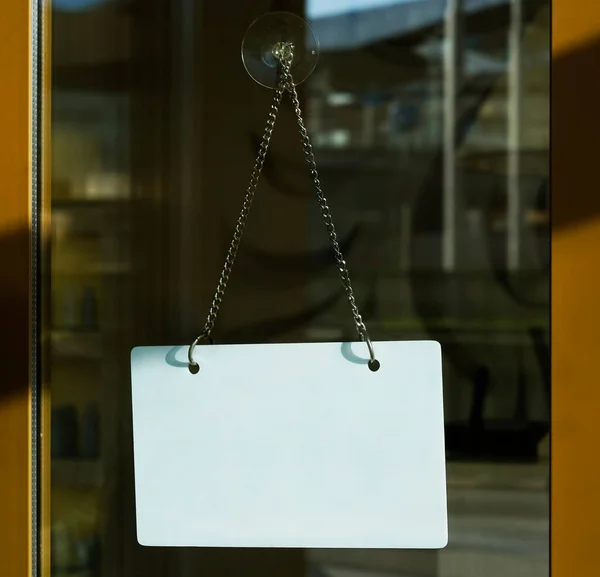 Close White Empty Signboard Hanging Glass Door Cafe Blurry Background — Stock Photo, Image