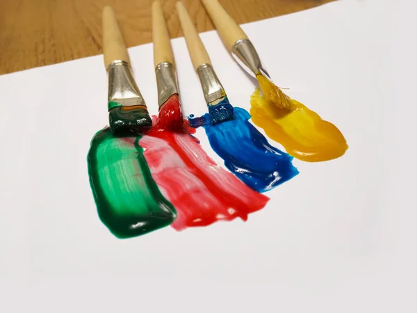 Colorful Paint Strokes Paint Cans White Sheet Paper Wooden Table — Stock Photo, Image