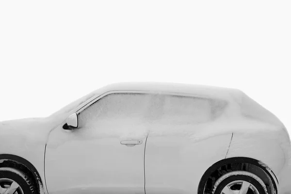 Frozen car side window in snow,  glass background. Snow covered frozen car covered with snow. Winter road. Danger of winter driving. Car snow removal. Dangerous traffic situation.