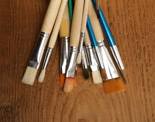 Many Paint Brushes Glasses Jar Isolated Wooden Table Background — Stock Photo, Image