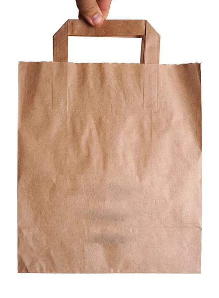 棕色工艺纸袋 白色背景下男性手隔离的生态产品 — 图库照片
