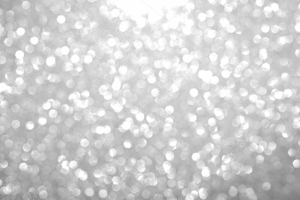 Bokeh gray background. Silver abstract bokeh snow falling winter christmas holiday background