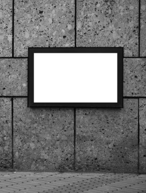 dış arkaplan. Taş duvarda asılı boş bir çerçeve ve kaldırım taşı zemin. boş resim çerçevesi tasarımınız için hazır 