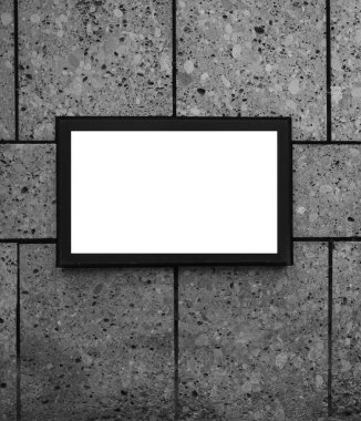 dış arkaplan. Taş duvarda asılı boş bir çerçeve ve kaldırım taşı zemin. boş resim çerçevesi tasarımınız için hazır 