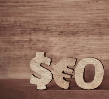 Seo - Dolar ve avro işaretlerinden yapılmış ahşap kelime. 