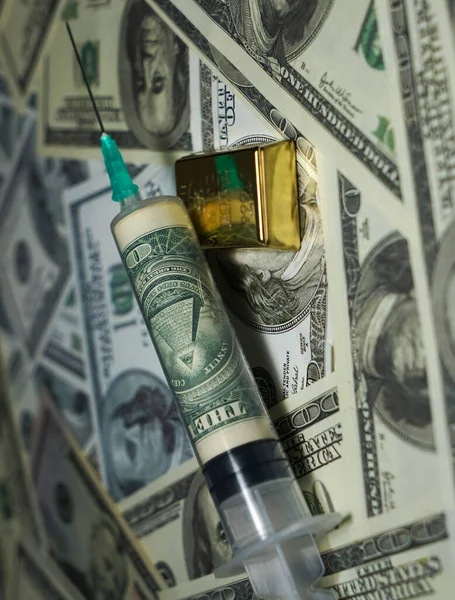 Syringe with 1 one  dollar banknote inside on 100 hundred dollar banknotes background. pyramid with an all-seeing eye. gold bar