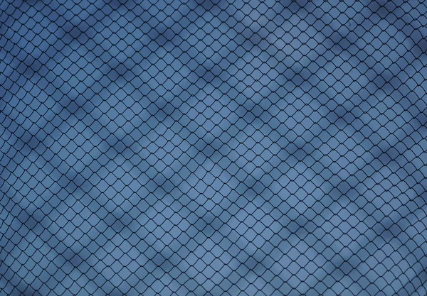 steel net isolated on blue sky background. silhouetted iron net against  sky