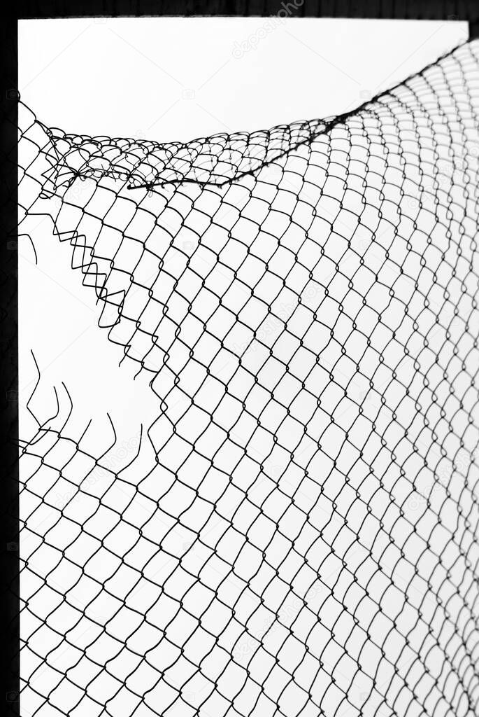 damage wire mesh on white background. Mesh netting with hole isolated on white background            