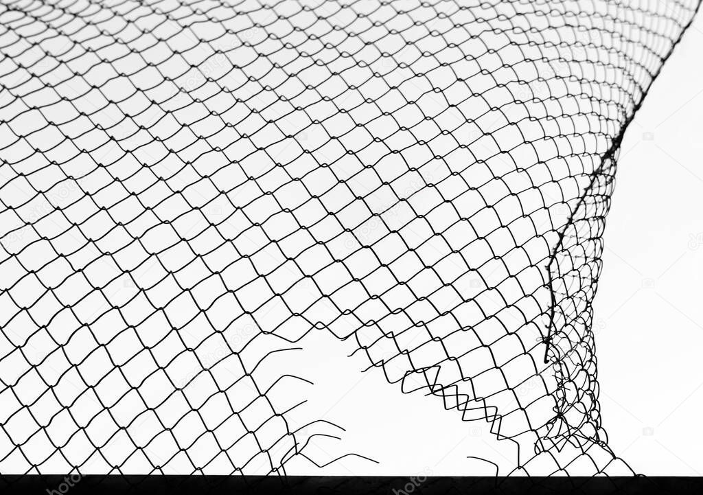 damage wire mesh on white background. Mesh netting with hole isolated on white background            