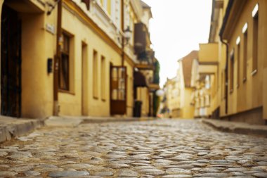 Old town in Europe at sunset with retro vintage cobble stones. Vilnius, Lithuania
