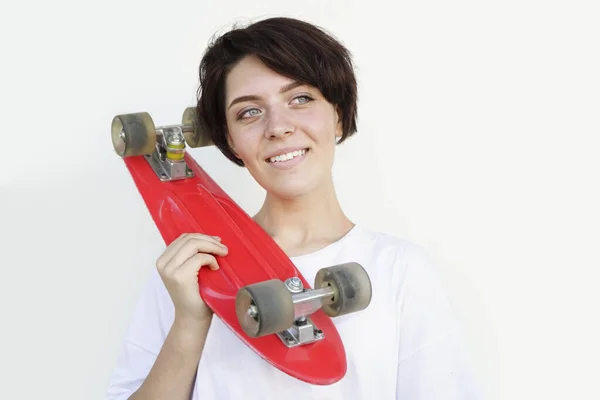 Young Woman Holding Red Skateboard Shoulder Isolated White Background — Zdjęcie stockowe