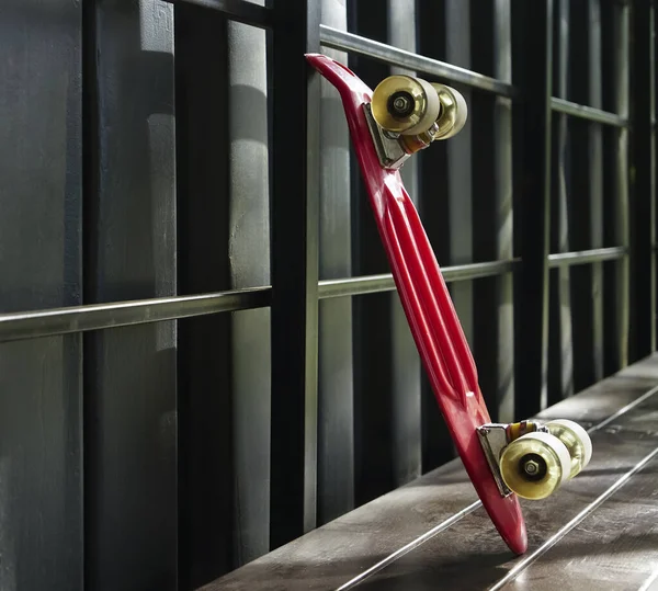 Modern Red Skateboard Stands Black Metal Wall Close Image Empty — Stockfoto