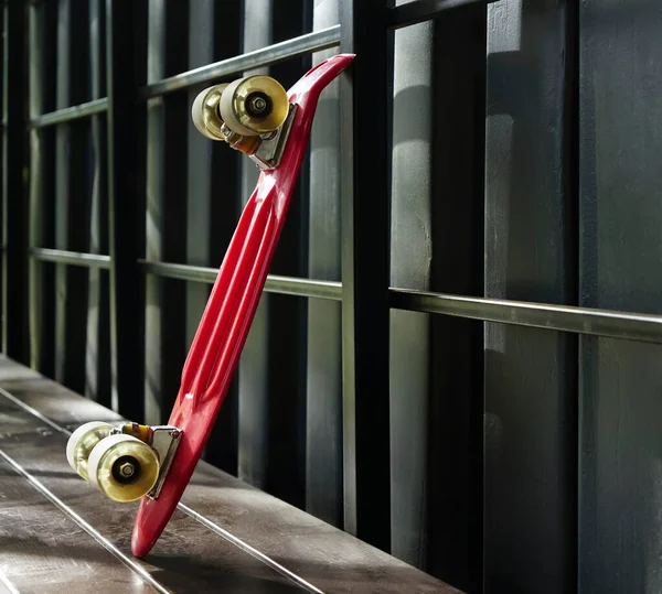 Modern Red Skateboard Stands Black Metal Wall Close Image Empty — ストック写真