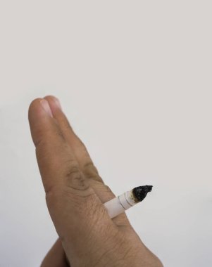 close up man hand with burning cigarette as penis in smoking. Man hand with burning cigarette as penis in smoking cause sexual