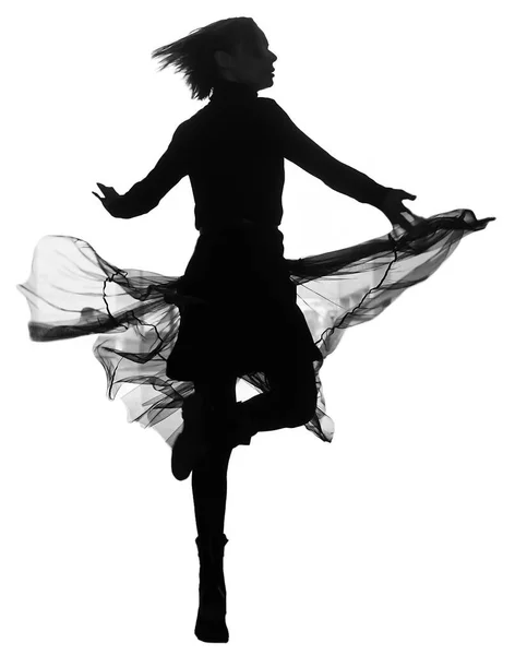 女は音楽に合わせて踊る 女の子が踊ってるシルエット 白い背景に隔離され — ストック写真