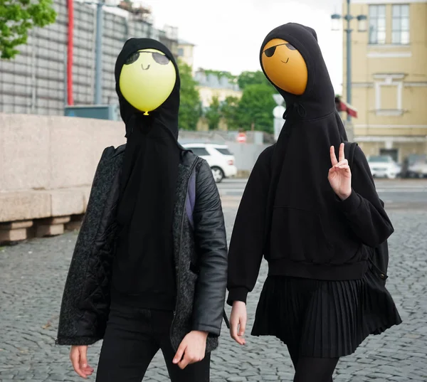 Young Girls Wearing Black Hoodie Walking Street Balloons Hood Faces — Stock Photo, Image