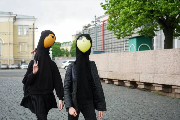 Young Girls Wearing Black Hoodie Walking Street Balloons Hood Faces — Stock Photo, Image