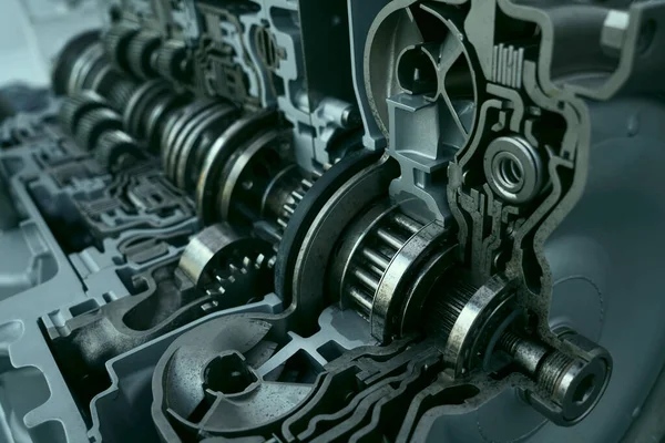 Planetary gears inside automatic transmission  in the context.  Metal mechanism. Steel. Engineering. Heavy industry. Concept - production of metal spare parts. Industrial topics.