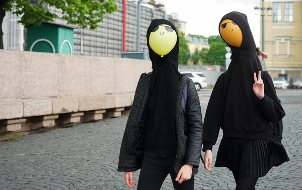 Young Girls Wearing Black Hoodie Walking Street Balloons Hood Faces — Stock Photo, Image