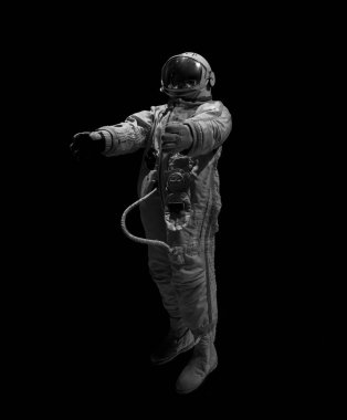 Siyah arkaplanda izole edilmiş beyaz uzay giysisi içindeki astronot.